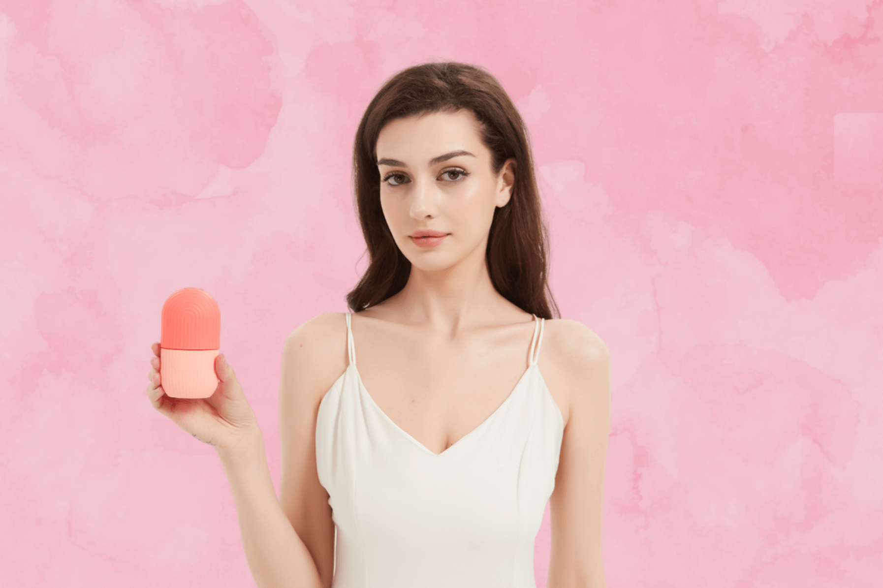 Model holding the IceGlow Face Roller for a refreshing skincare routine.