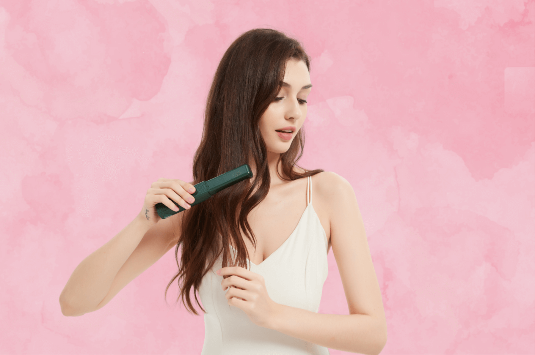 Model using the MiniLuxe Styler to straighten her hair for a sleek look.